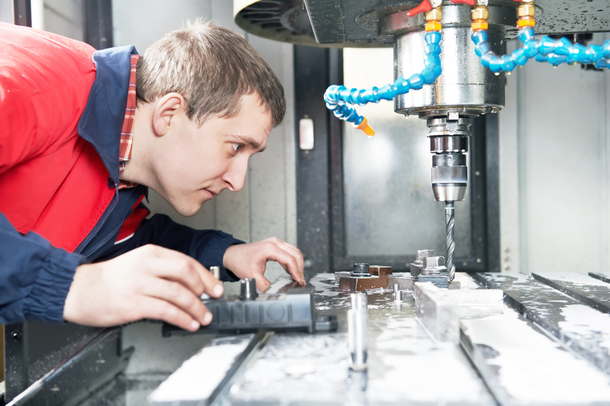 Technician Troubleshoots CNC Drilling Machine