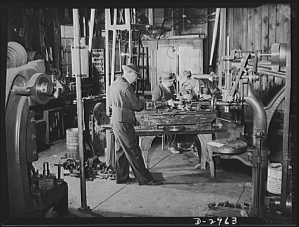 Credit: Library of Congress -<br /> Subcontracting (Beery and Sons). Plant conversion means machine conversion. Here workers at the Harrisonburg, Virginia shop of Beery and Sons are converting a lathe to turn out parts for a war contractor. All the actual work of conversion and the new tools and jigs needed are made in the shop<br /> Names<br /> United States. Office for Emergency Management.